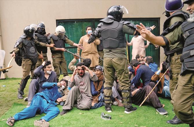 PTI workers under police siege. (AP/PTI)